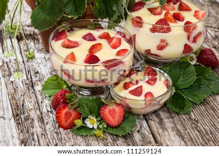 Different sizes of Vanilla Pudding on wooden background