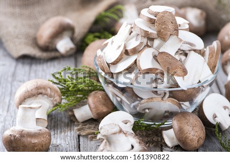 Fresh sliced Mushrooms on vintage background