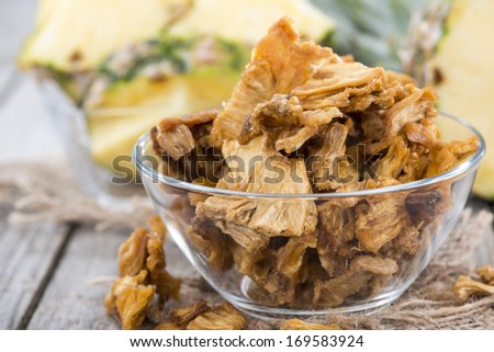Portion of dried Pineapple (close-up shot with some fresh fruits)
