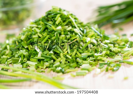 Small portion of fresh cutted Chive on vintage background