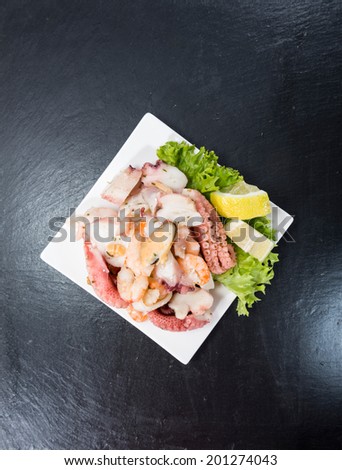 Mixed Seafood Salad with squid, mussels and shrimps (detailed studio shot)