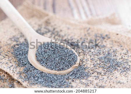Wooden Spoon with a small portion of Poppyseed
