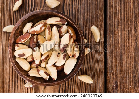 Brazil Nuts (detailed close-up shot) on an old vintage background