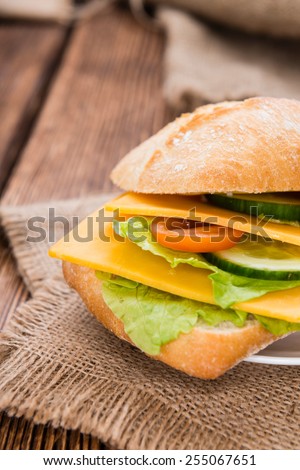 Cheddar Cheese Sandwich (detailed close-up shot) on wooden background