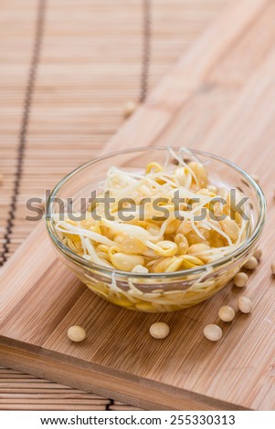 Preserved Soy Sprouts (close-up shot) on wooden background