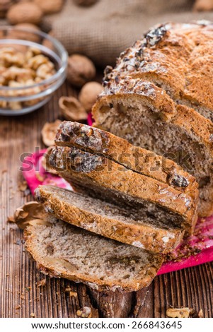 Fresh made Walnut Bread (detailed close-up shot) on wooden background
