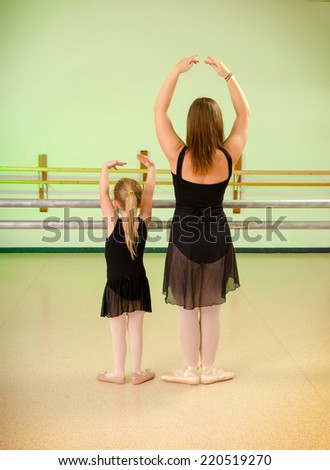 A Preschool Child with Teacher in Primary Ballet Class at Dance School Studio