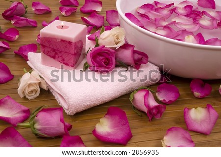 Spa Treatment with aromatic roses, petals, and candle