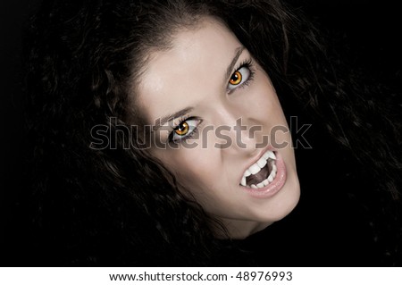 Vampire With Pale Face, Fangs, And Scary Eyes Stock Photo 48976993 ...