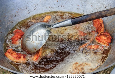 fried pork in oil pan
