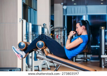 fitness, sports, training, technology and vision for the future lifestyle - smiling woman with the implementation of the simulator exercises in the gym
