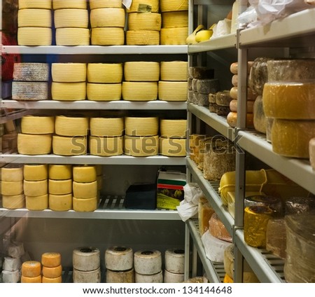 Shelves full of different cheese