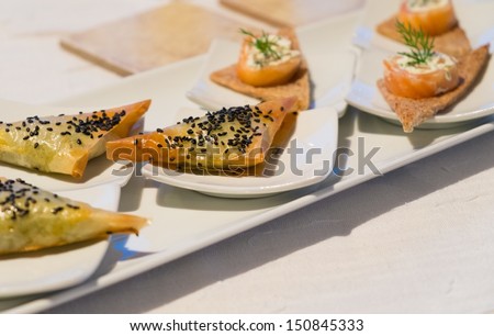 Tasty snacks on a little plates