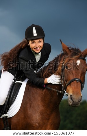 Similar – Image, Stock Photo Woman in jockey outfit standing with horse