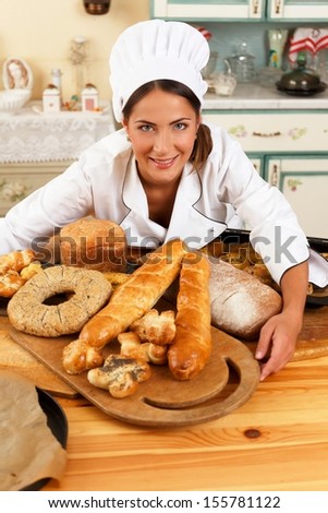 Woman cook and table with lot of homemade baked goods