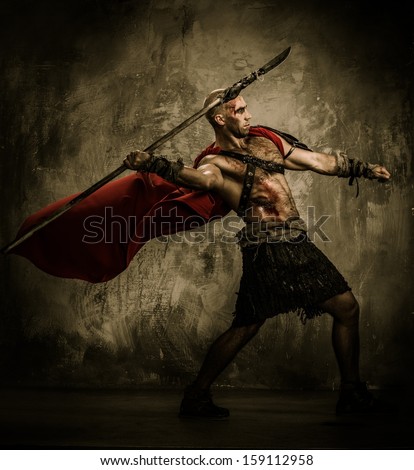 Wounded gladiator in red coat throwing spear