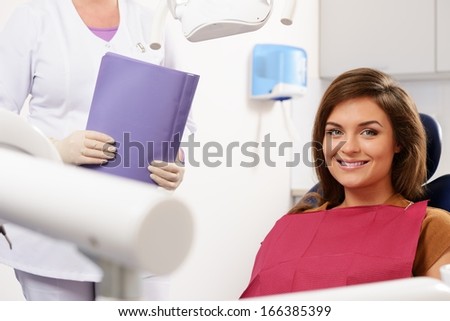 Young beautiful brunette woman at dentist\'s surgery