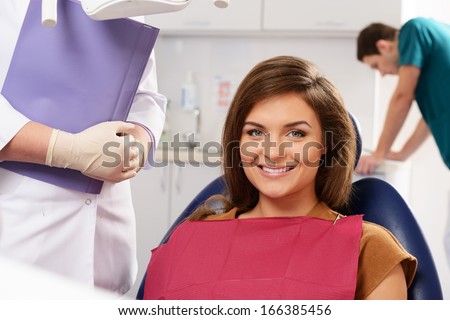 Young beautiful brunette woman at dentist\'s surgery