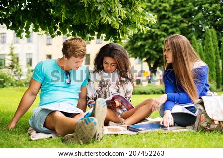 Group of multi ethnic students in a city park