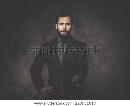 Handsome well-dressed man with walking stick