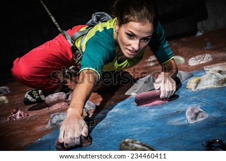 Similar – Image, Stock Photo Woman rock climbing indoors.