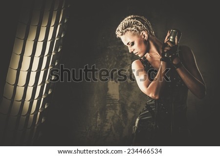 Attractive steampunk singer with microphone