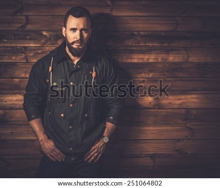 Handsome man with beard  wearing waxed canvas jacket