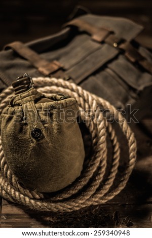 Messenger bag, flask and rope