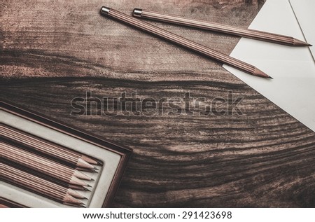 Luxurious charcoal drawing pencils on a wooden table