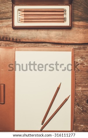 Luxurious pencils on a wooden table