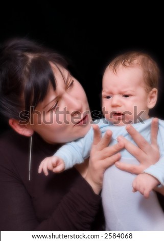 Mother tries to calm her crying child