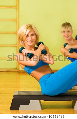 Beautiful women exercising in fitness club