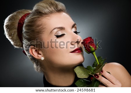 Charming lady with red rose