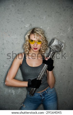 Sexy blonde with big metal hammer
