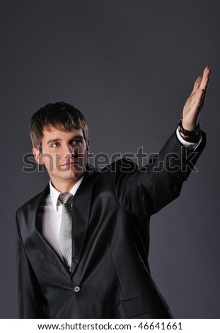 Handsome young businessman with outstretched hand