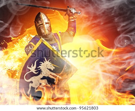 Medieval knight in attack position on fire background.