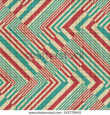 Abstract striped geometric ornament printed on textured linen canvas fabric background. Seamless pattern.