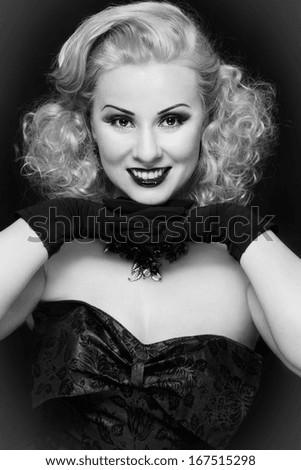 Black and white portrait of smiling happy vintage beauty with curly hair
