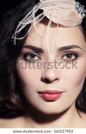 Close-up portrait of beautiful woman with fancy vintage hair accessory