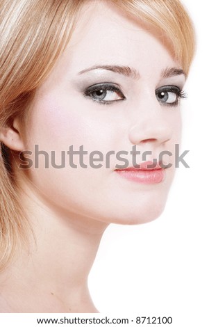 Portrait of grey-eyed tender beautiful girl with clear skin and trendy makeup