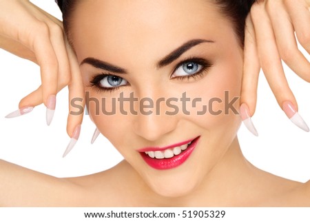 Close-up portrait of young beautiful smiling girl with stylish make-up and long nails