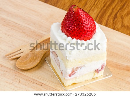 Strawberry cake on wooden background, Cake with strawberries, Piece of cake.