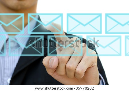 businessman pushing mail for social network on a touch screen interface.