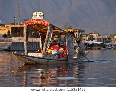 KASHMIR, INDIA-APRIL 10: The unique decorative style of touring boat on April 10, 2009 in Kashmir, India. People are to use \'Shikara\' for traveling and transportation in Dal lake.
