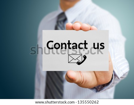 Businessman showing contact us card