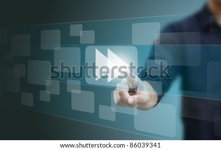 hand pushing a fast forward button on a touch screen interface