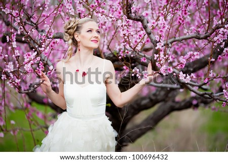 Beautiful bride in blossom garden