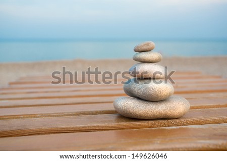 Stack of stones on the wood flooring