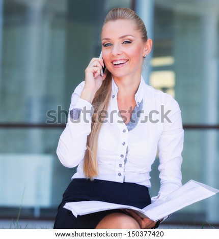 Business women with stack of papers in hand