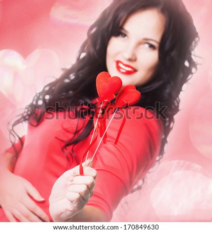 Girl with red heart in hand